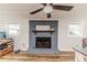 Living room fireplace with painted brick and a decorative mantel at 2104 Live Oak Dr, Sanford, NC 27330