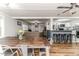 Open floor plan with a large wooden dining table and connected kitchen at 2104 Live Oak Dr, Sanford, NC 27330
