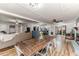 Open concept living space featuring a dining table, a living room set, and hardwood floors at 2104 Live Oak Dr, Sanford, NC 27330