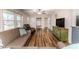 Open-concept living area with a ceiling fan and wood flooring at 2104 Live Oak Dr, Sanford, NC 27330