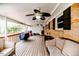 Covered back patio featuring ceiling fans, outdoor seating, and brick exterior at 2104 Live Oak Dr, Sanford, NC 27330