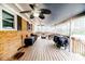 Covered back patio featuring ceiling fans, outdoor seating, and wood deck at 2104 Live Oak Dr, Sanford, NC 27330