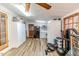 Sunroom with gym equipment, laundry, fridge, lots of light, and a ceiling fan at 2104 Live Oak Dr, Sanford, NC 27330