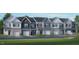 Attractive two-story townhome with a one-car garage and modern architectural details at 2205 Carcillar Dr, Apex, NC 27539