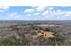 Wide aerial view of the landscape showcasing a mix of fields and residences amidst abundant trees at 2232 Miller Rd, Hillsborough, NC 27278
