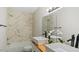 Modern bathroom featuring dual vessel sinks, a tiled shower-tub combination, and stylish fixtures at 2232 Miller Rd, Hillsborough, NC 27278