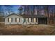 Charming single-story home featuring a white brick facade, black shutters, and an attached screened-in porch at 2232 Miller Rd, Hillsborough, NC 27278