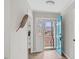 Charming foyer featuring a bright blue front door and wood-look flooring at 2232 Miller Rd, Hillsborough, NC 27278