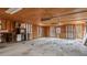 Unfinished garage features exposed wood framing and ample space for storage at 2232 Miller Rd, Hillsborough, NC 27278