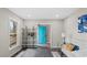 Living room featuring a bright teal door and hardwood flooring at 2232 Miller Rd, Hillsborough, NC 27278