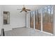 The sunroom features tiled floors, large windows with views, and access to the backyard at 2232 Miller Rd, Hillsborough, NC 27278