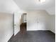 Cozy bedroom with neutral carpet and a view to another room through an open doorway at 26 Malbry Pl, Durham, NC 27704