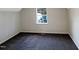 Simple bedroom with new carpet and a bright window at 26 Malbry Pl, Durham, NC 27704