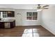 Dining area featuring dark wood cabinets and hardwood floors at 26 Malbry Pl, Durham, NC 27704