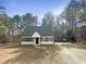 Charming single Gathering home featuring a manicured front lawn and a private lot surrounded by mature trees at 26 Malbry Pl, Durham, NC 27704