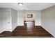 Bright living room with hardwood floors and neutral paint ready for furnishings at 26 Malbry Pl, Durham, NC 27704