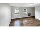 Spacious living area featuring sleek flooring, natural light, and neutral paint at 26 Malbry Pl, Durham, NC 27704