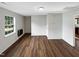 Simple living area featuring hardwood floors and a window at 26 Malbry Pl, Durham, NC 27704