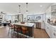 Bright, open kitchen with a large island, stainless steel appliances, and seamless flow to the living area at 2644 Catheys Creek Cir, Wendell, NC 27591