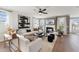 Bright living room features a modern fireplace, large windows, and comfortable seating at 2644 Catheys Creek Cir, Wendell, NC 27591