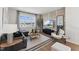 Cozy living room showcasing stylish decor, modern furniture, and bright natural light from the large window at 2644 Catheys Creek Cir, Wendell, NC 27591