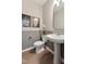Stylish powder room featuring modern fixtures, mirror and elegant decor at 2644 Catheys Creek Cir, Wendell, NC 27591