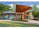 Striking architecture with curved wood elements and ample windows facing a well-manicured lawn at 2800 Kempthone Rd # 65, Cary, NC 27519