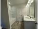 Bright bathroom featuring a double vanity, large mirror, and bath tub at 316 Olivia Crossing Ct # 11, Four Oaks, NC 27524