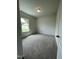 Cozy bedroom with plush carpeting and a bright window at 316 Olivia Crossing Ct # 11, Four Oaks, NC 27524