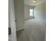 Cozy bedroom with plush carpeting and a bright window at 316 Olivia Crossing Ct # 11, Four Oaks, NC 27524