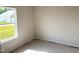 Bedroom with a large window offering exterior view, providing a bright and airy atmosphere at 316 Olivia Crossing Ct # 11, Four Oaks, NC 27524