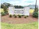 Stone entrance sign for Chamblee community. Well maintained landscaping at 316 Olivia Crossing Ct # 11, Four Oaks, NC 27524