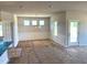 Bright dining area with white trim, a modern chandelier, and ample natural light from large windows at 316 Olivia Crossing Ct # 11, Four Oaks, NC 27524