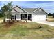 Charming single-story home with gray siding, white trim, and a well-maintained front yard at 316 Olivia Crossing Ct # 11, Four Oaks, NC 27524