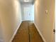 Inviting hallway leading to the front door, featuring neutral paint and well-lit space at 316 Olivia Crossing Ct # 11, Four Oaks, NC 27524