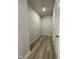 Hallway with vinyl flooring and neutral walls at 316 Olivia Crossing Ct # 11, Four Oaks, NC 27524