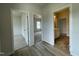 Hallway with view of bedroom, bathroom, and neutral walls at 316 Olivia Crossing Ct # 11, Four Oaks, NC 27524