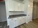 Kitchen with white cabinets, granite countertops, stainless steel appliances, and butler's pantry at 316 Olivia Crossing Ct # 11, Four Oaks, NC 27524