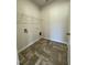 Laundry room with tile flooring, wire shelving, and hookups at 316 Olivia Crossing Ct # 11, Four Oaks, NC 27524