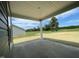 Covered patio with view of grassy area and blue sky at 316 Olivia Crossing Ct # 11, Four Oaks, NC 27524