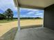 Covered patio with view of grassy area and blue sky at 316 Olivia Crossing Ct # 11, Four Oaks, NC 27524