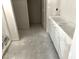 Unfinished area with a closet and cabinets covered in plastic, ready for customization at 316 Olivia Crossing Ct # 11, Four Oaks, NC 27524