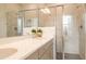 Modern bathroom with double sinks, a glass shower, and stylish finishes at 322 Clementine Dr, Cary, NC 27519
