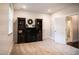 Spacious bedroom featuring carpet floors, neutral paint, shelving units, and easy bathroom access at 322 Clementine Dr, Cary, NC 27519