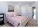 Bright bedroom features a white bed frame, decorative wall art, and recessed lighting at 322 Clementine Dr, Cary, NC 27519