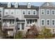 Charming townhome with inviting front porch and well-maintained landscaping at 322 Clementine Dr, Cary, NC 27519