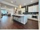 Bright kitchen features a large center island with seating and sleek stainless steel appliances at 322 Clementine Dr, Cary, NC 27519