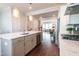 Open kitchen boasts an island with seating and stainless steel appliances, perfect for modern living at 322 Clementine Dr, Cary, NC 27519