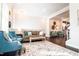Comfortable living room featuring plush seating, a stylish rug, and bright, neutral walls at 322 Clementine Dr, Cary, NC 27519