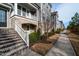 Street view of charming townhomes with landscaped sidewalks at 322 Clementine Dr, Cary, NC 27519